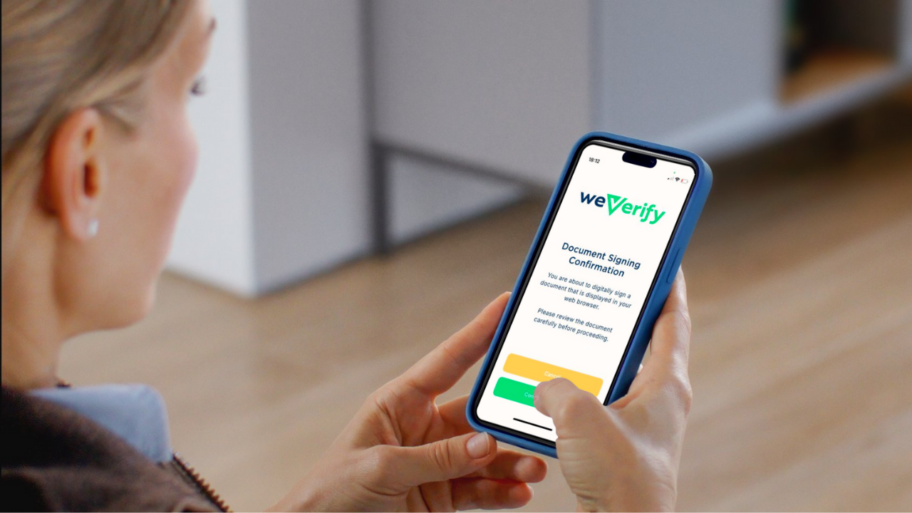 Person signing document using weVerify app